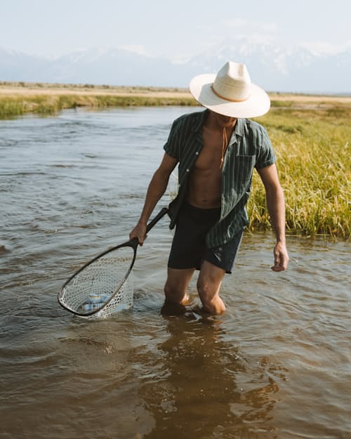 lifestyle image of Palm Straw Sun Hat