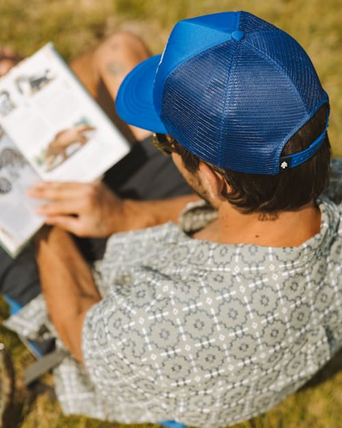 lifestyle image of Huckberry Adventure Company Foam Trucker Hat