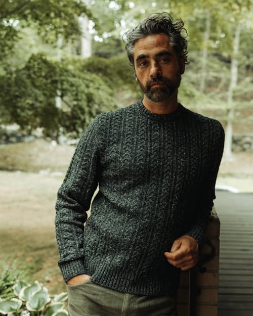 lifestyle image of Highlands Guide Cable Crewneck Sweater