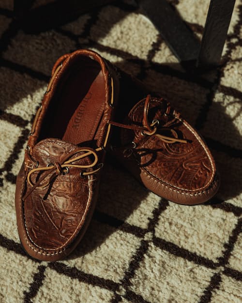 lifestyle image of Huckberry x Quoddy Coolslide Stamped Leather Slipper