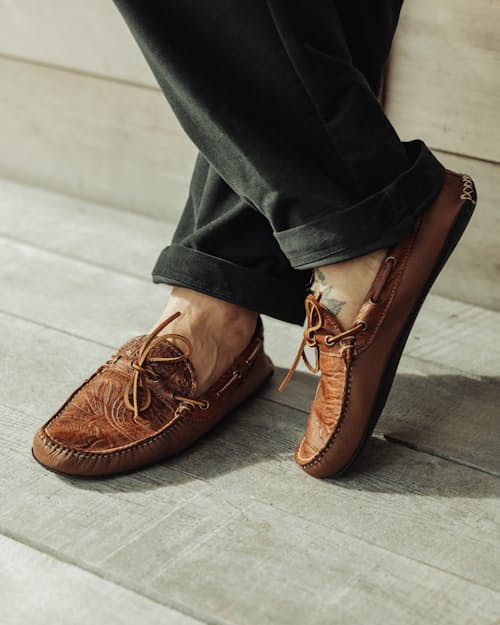 lifestyle image of Huckberry x Quoddy Coolslide Stamped Leather Slipper