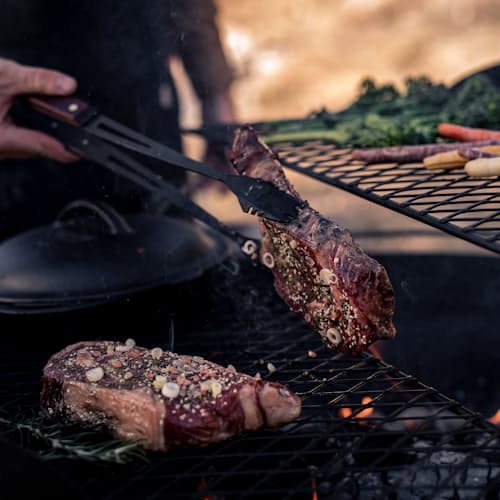 lifestyle image of Cowboy Firepit Grill - 30"