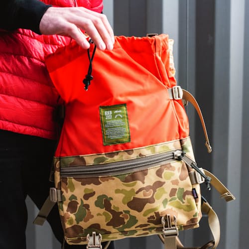 laydown image of Topo Designs x Nanga x Natal - 1000D Camo Rover Shoulder Bag