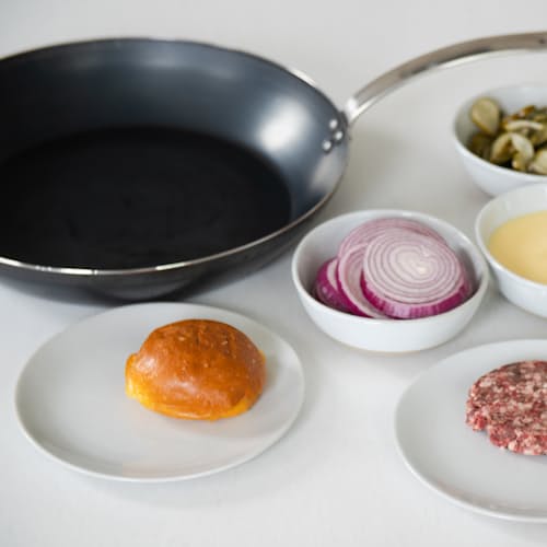 laydown image of Blue Carbon Steel Frying Pan