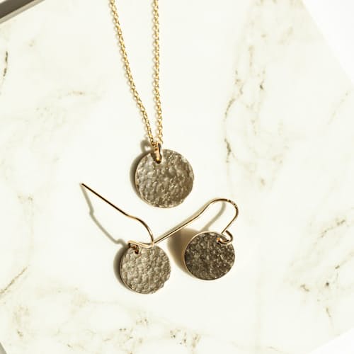 laydown image of Women's Gold Water Earrings + Necklace
