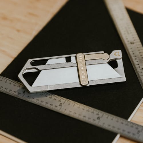 laydown image of Sideslip Titanium Utility Knife
