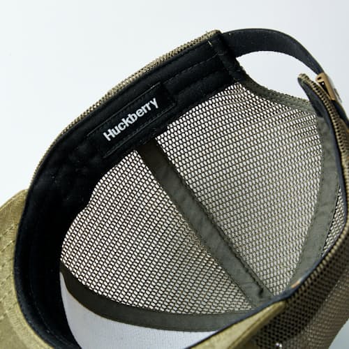 laydown detail image of Waxed Canvas Tree Trucker Hat - Medium Profile