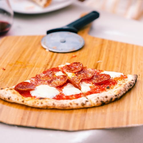 lifestyle image of Ooni 12" Bamboo Pizza Peel