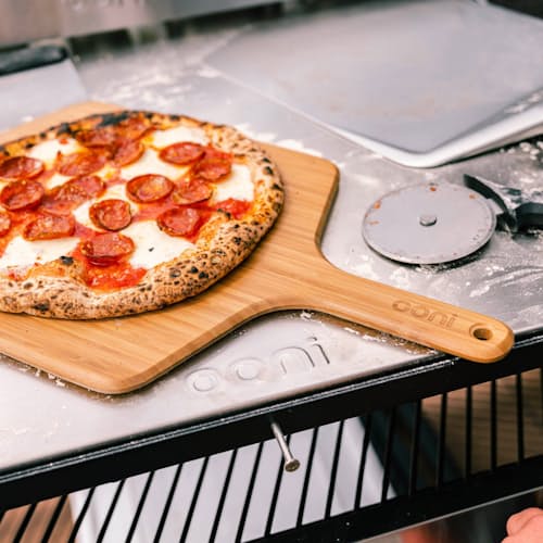 lifestyle image of Ooni 16" Bamboo Pizza Peel