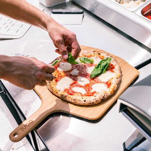 lifestyle image of Ooni 16" Bamboo Pizza Peel