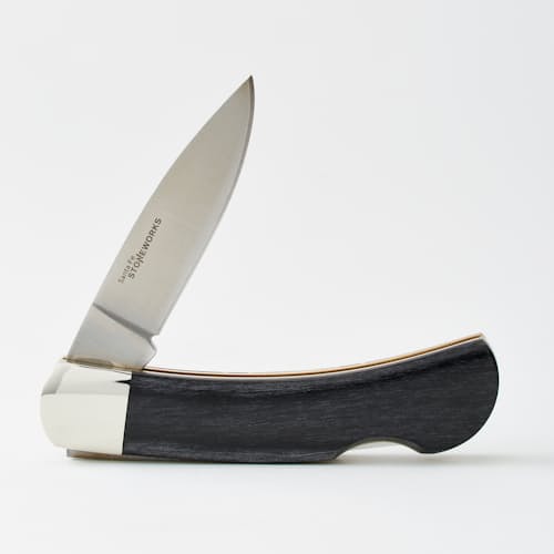 laydown image of G-10 + Natural Mammoth Tooth Pocket Knife