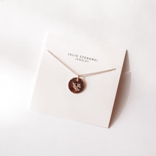 laydown image of Larkspur Floral Coin Necklace