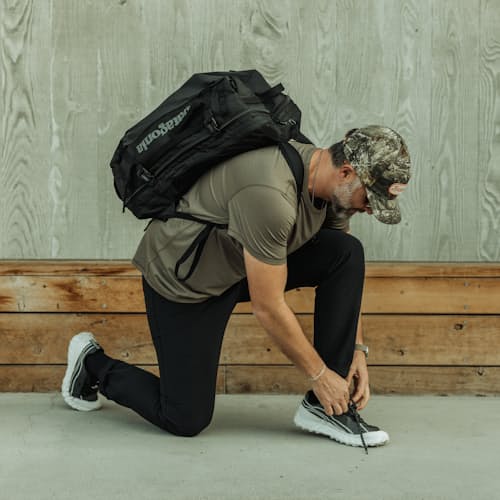 lifestyle image of Black Hole MLC Travel Backpack - 45L