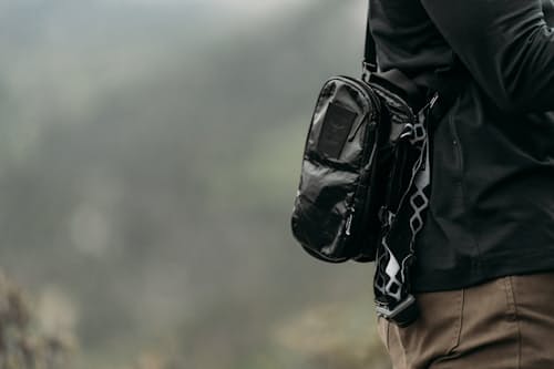 on model image of Osprey x Carryology Archeon Pouch