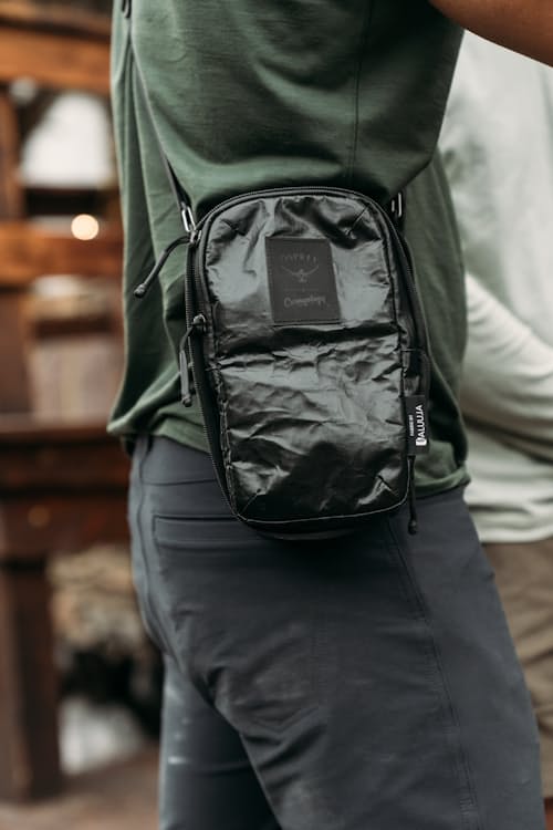 on model image of Osprey x Carryology Archeon Pouch