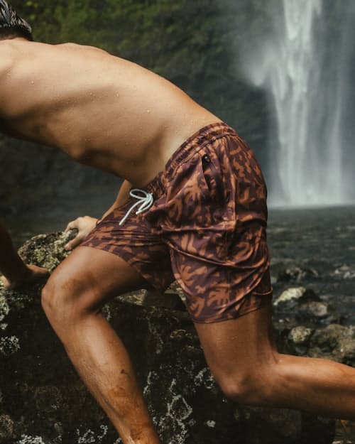 lifestyle image of Performance Lined Swim Trunks - 7"
