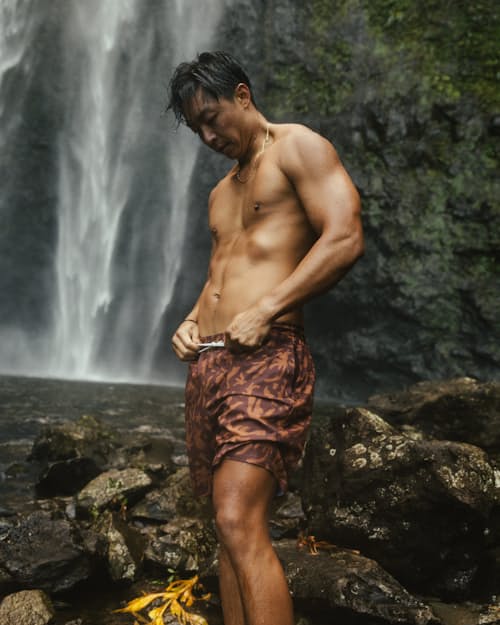 lifestyle image of Performance Lined Swim Trunks - 7"