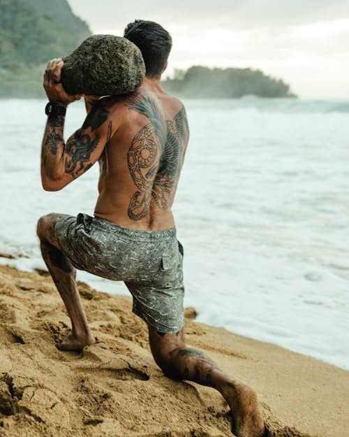 lifestyle image of Performance Lined Swim Trunks - 7"
