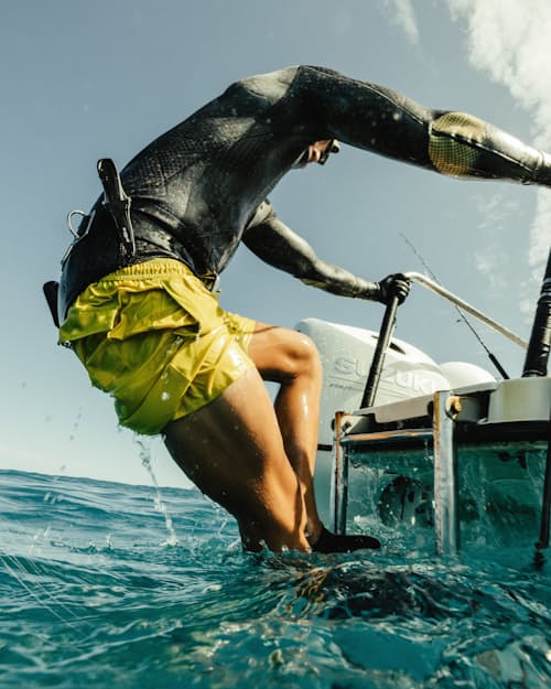 lifestyle image of Performance Lined Swim Trunks - 7"