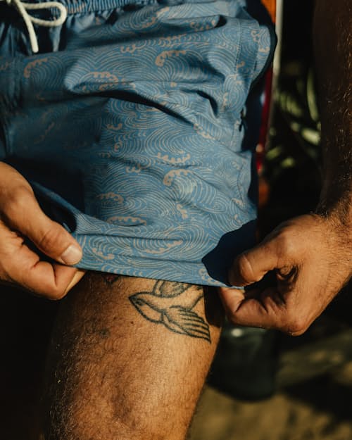 lifestyle image of Performance Lined Swim Trunks - 5"