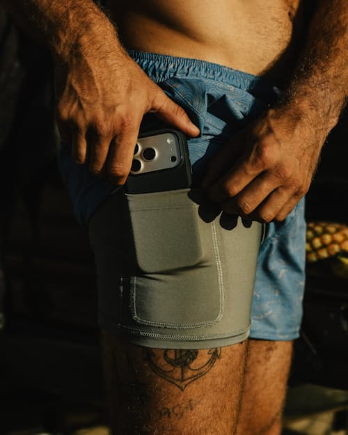 lifestyle image of Performance Lined Swim Trunks - 5"