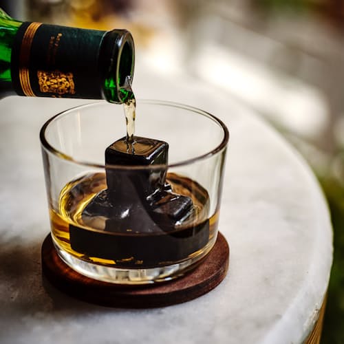 laydown image of Dark Granulite Hornblende Whiskey Stones with Tray