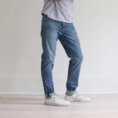 on model image of Graham Relaxed Tapered Denim Jeans