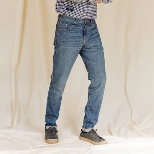 on model image of Graham Relaxed Tapered Denim Jeans