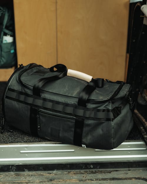 lifestyle image of Huckberry x Brown Buffalo Herringbone Twill Duffalo 50L