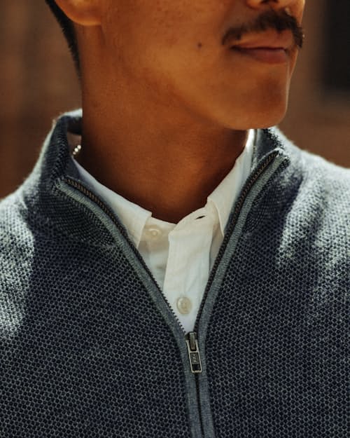 lifestyle image of Easycash Merino Quarter Zip Sweater
