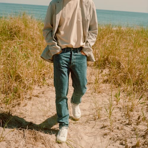 lifestyle image of Classic Tapered Selvedge Denim Jeans