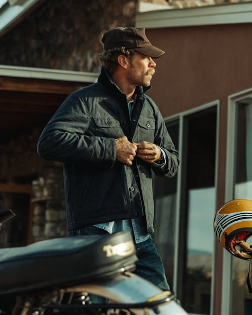 lifestyle image of Flannel-Lined Quilted Waxed Rancher Jacket