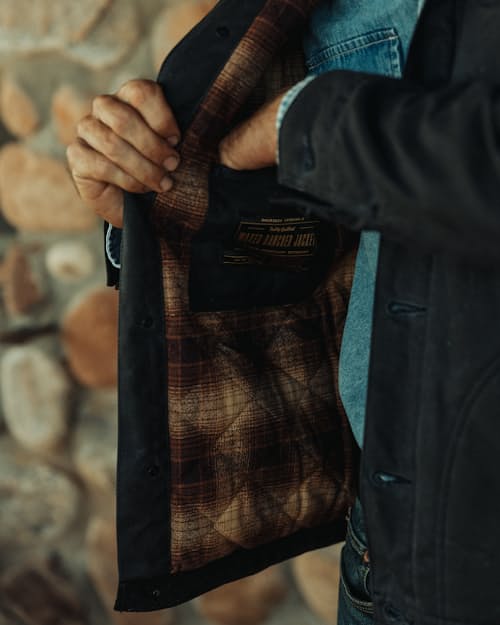 lifestyle image of Flannel-Lined Quilted Waxed Rancher Jacket