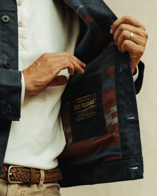 lifestyle image of Flannel-Lined Waxed Trucker Jacket - Special Edition