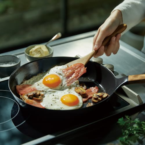 lifestyle image of Cast Iron Frying Pan with Lid - 10.2"