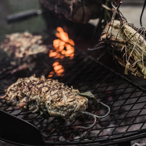 lifestyle image of Cowboy Firepit Grill - 30"