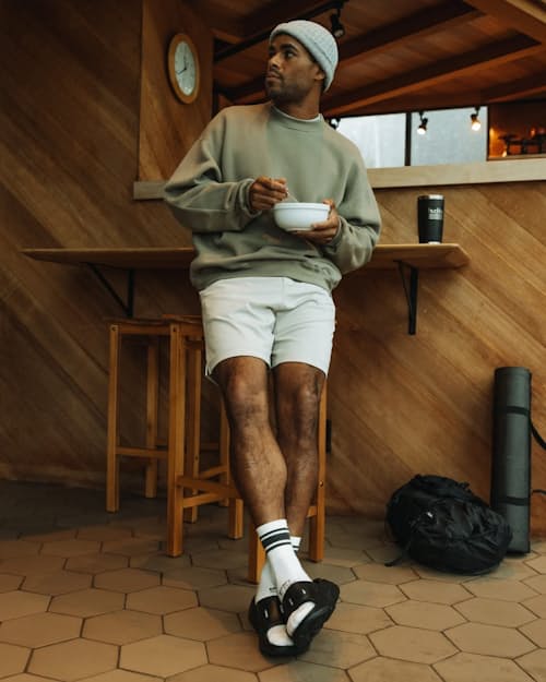 Michael is 5'8", 170lbs, and wearing a size M in Natural Heather