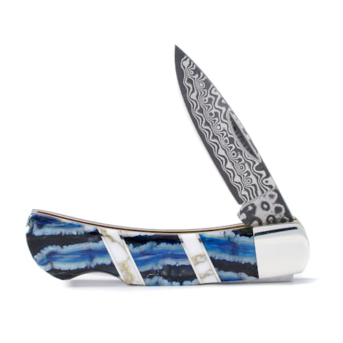 laydown image of Rare Blue Mammoth Tooth + Jasper Damascus Knife