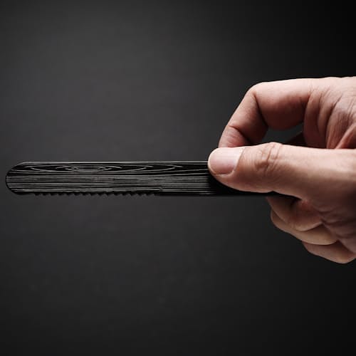 laydown image of Hand Warming Butter Knife