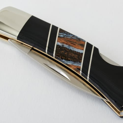 laydown image of G-10 + Natural Mammoth Tooth Pocket Knife