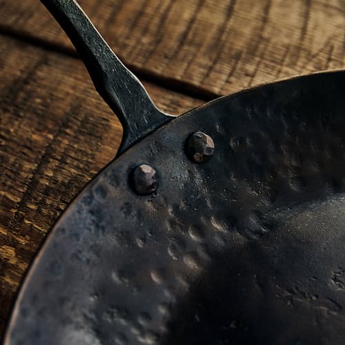 laydown image of Carbon Steel Farmhouse Skillet