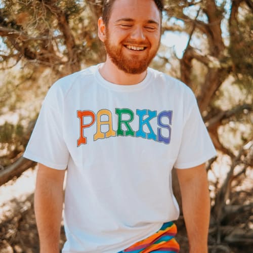 laydown image of Adventure with Pride Parks Tee