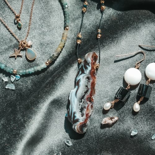 laydown image of Black Tourmaline + Pearl Earring