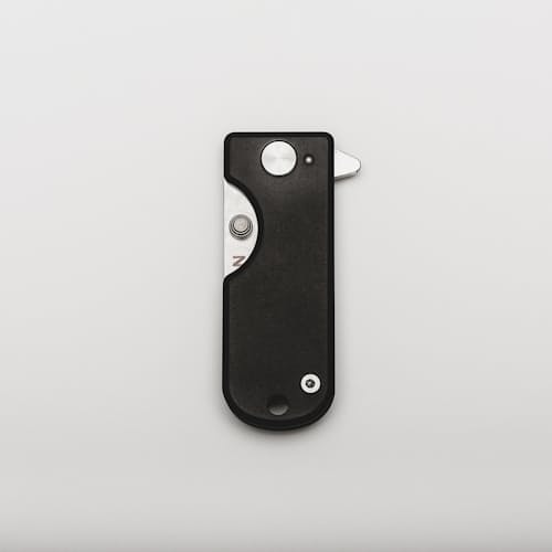 laydown image of Micro Blade Pocket Knife - Titanium