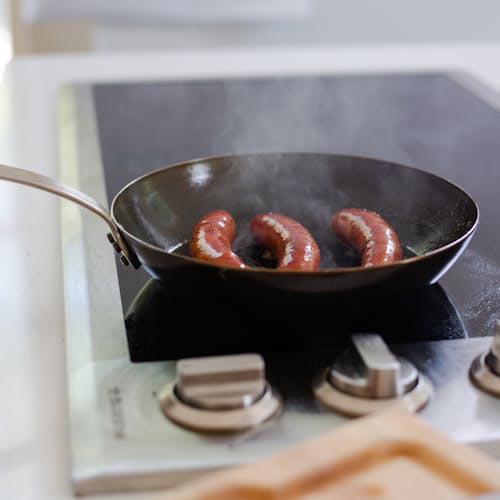 laydown image of Blue Carbon Steel Frying Pan